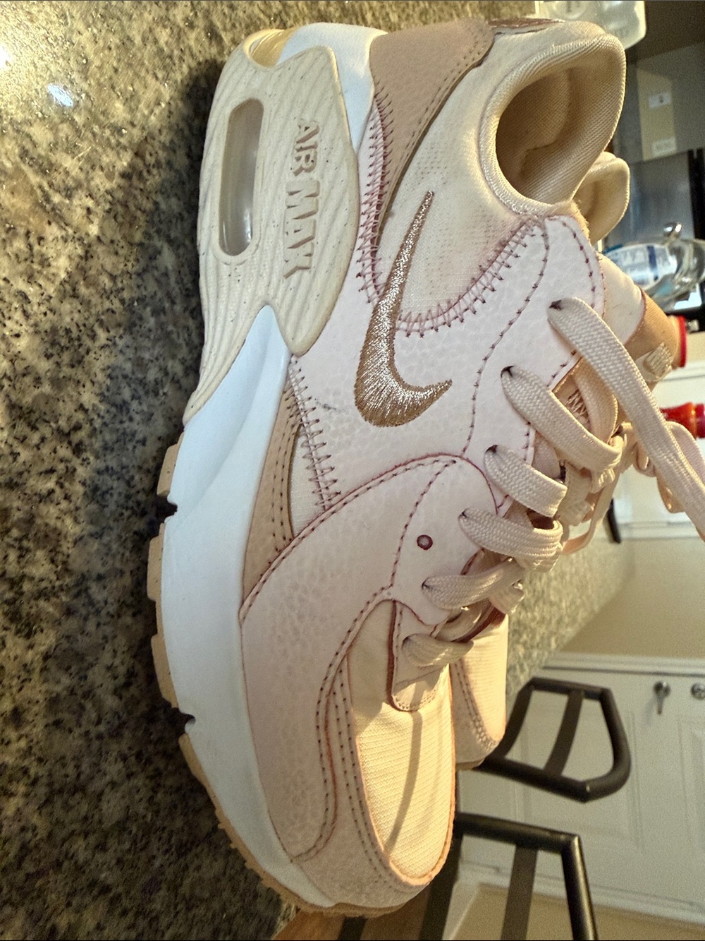 Nike Women’s Blush Pink Low-Top Sneakers with Gold Accent